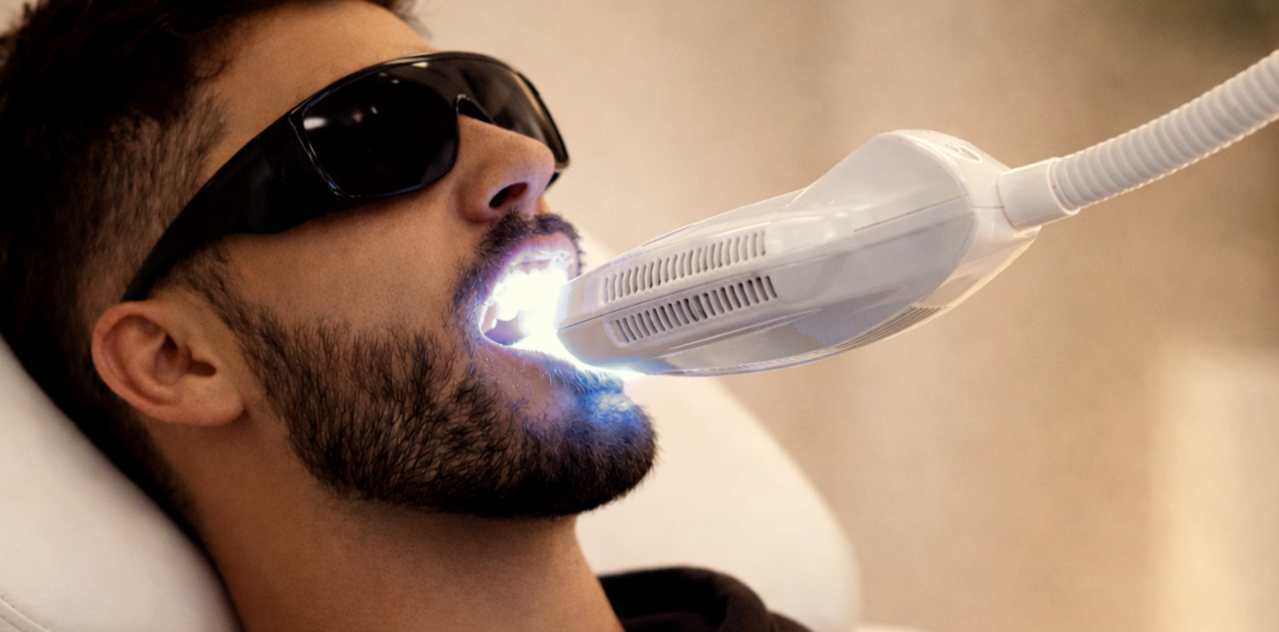Client receiving teeth whitening treatment